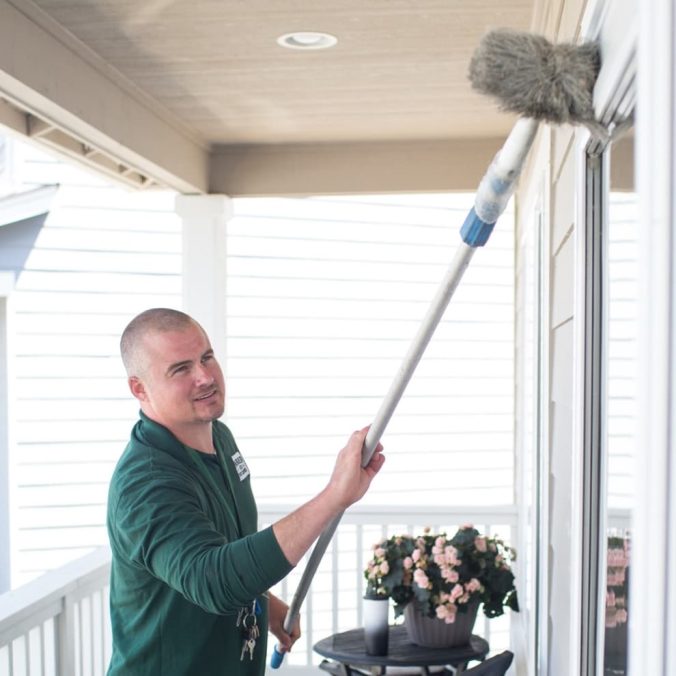 cleaning spider cobwebs around a home
